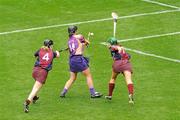 11 September 2011; Wexford's Ursula Jacob shoots to score her side's second goal despite the challenge of Lorraine Ryan, left, and Heather Cooney, right. All-Ireland Senior Camogie Championship Final in association with RTE Sport, Galway v Wexford, Croke Park, Dublin. Picture credit: Pat Murphy / SPORTSFILE