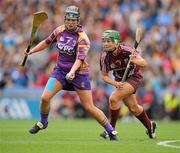 11 September 2011; Una Leacy, Wexford, in action against Heather Cooney, Galway. All-Ireland Senior Camogie Championship Final in association with RTE Sport, Galway v Wexford, Croke Park, Dublin. Picture credit: David Maher / SPORTSFILE