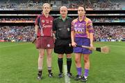 11 September 2011; Referee Mike O'Kelly with captains, Ursula Jacob, right, Wexford, and Brenda Hanney, Galway. All-Ireland Senior Camogie Championship Final in association with RTE Sport, Galway v Wexford, Croke Park, Dublin. Picture credit: David Maher / SPORTSFILE