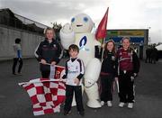 10 September 2011; The Lynch family from Gort, Co. Galway, left to right, Ellen, aged 12, Harry aged 6, Rosie, aged 8, Lily, aged 10, with the Bord Gais Energy Bot mascot. Semple Stadium, Thurles, Co. Tipperary. Picture credit: Dáire Brennan / SPORTSFILE