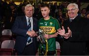 29 March 2017; Kerry captain Brian Sugrue is presented with the trophy by Diarmuid O'Sullivan, Chairman of Munster GAA in the company of John O’Connor, Chairman at EirGrid after the EirGrid Munster GAA Football U21 Championship Final match between Cork and Kerry at Páirc Ui Rinn in Cork. Photo by Stephen McCarthy/Sportsfile