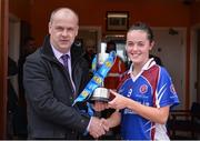 31 March 2017; Ciara McCarthy of Colaiste Bhaile Chláir is presented with cup by Connacht LGFA President Liam McDonagh following the Lidl All Ireland PPS Junior C Championship final match between Colaiste Bhaile Chláir and St. Columbas at Connolly Park in Sligo. Photo by Sam Barnes/Sportsfile