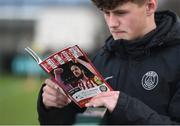 31 March 2017; A Derry city fan reads the match programme prior to the SSE Airtricity League Premier Division match between Derry City and Bray Wanderers at Maginn Park in Buncrana, Co Donegal. Photo by Oliver McVeigh/Sportsfile