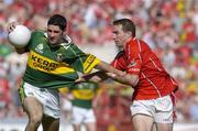 10 July 2005; Bryan Sheehan, Kerry, is tackled by Eoin Sexton, Cork. Bank of Ireland Munster Senior Football Championship Final, Cork v Kerry, Pairc Ui Chaoimh, Cork. Picture credit; Pat Murphy / SPORTSFILE