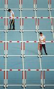 29 August 2011; Officials prepare the track ahead of the Men's 110m Hurdle Semi-Final. IAAF World Championships - Day 3, Daegu Stadium, Daegu, Korea. Picture credit: Stephen McCarthy / SPORTSFILE