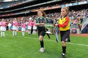 11 September 2011; Emma Lillis, of Muinebheag Camogie Club, Carlow, and Jenna Slattery, of Treaty Gaels Camogie Club, Limerick, right, carry the O'Duffy Cup onto the pitch before the game. All-Ireland Senior Camogie Championship Final in association with RTE Sport, Galway v Wexford, Croke Park, Dublin. Picture credit: Pat Murphy / SPORTSFILE