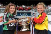 11 September 2011; Emma Lillis, of Muinebheag Camogie Club, Carlow, and Jenna Slattery, of Treaty Gaels Camogie Club, Limerick, right, carry the O'Duffy Cup onto the pitch before the game. All-Ireland Senior Camogie Championship Final in association with RTE Sport, Galway v Wexford, Croke Park, Dublin. Picture credit: Pat Murphy / SPORTSFILE