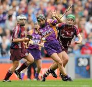 11 September 2011; Claire O'Connor, Wexford, in action against Ann Marie Starr, right, and Tara Ruttledge, Galway. All-Ireland Senior Camogie Championship Final in association with RTE Sport, Galway v Wexford, Croke Park, Dublin. Picture credit: Brian Lawless / SPORTSFILE