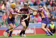 11 September 2011; Susan Earner, Galway, in action against Lenny Holohan, left, and Katrina Parrock, Wexford. All-Ireland Senior Camogie Championship Final in association with RTE Sport, Galway v Wexford, Croke Park, Dublin. Picture credit: Brian Lawless / SPORTSFILE