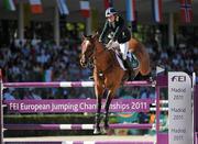 15 September 2011; Nicola FitzGibbon, from Kilteel, Co. Kildare, and Puissance while competing in the second days event at the FEI European Jumping Championships, Club de Campo Villa, Madrid, Spain. Picture credit: Ray McManus / SPORTSFILE