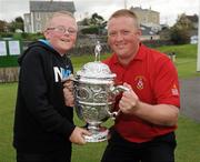 15 September 2011; Stephen Slattery, Team Captain, right , Mitchelstown Golf Club, Co. Cork, celebrates with his eleven year old son Emmett Slattery, after winning the Junior Cup  against Lurgan Golf Club, Co. Armagh. Chartis Cups and Shields Finals 2011, Castlerock Golf Club, Co. Derry. Picture credit: Oliver McVeigh/ SPORTSFILE