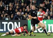 16 September 2011; New Zealand's Richard Kahui sidesteps a tackle from Japan's Itaru Taniguchi. 2011 Rugby World Cup, Pool A, New Zealand v Japan, Waikato Stadium, Hamilton, New Zealand. Picture credit: David Rowland / SPORTSFILE