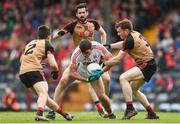 2 April 2017; Peter Kelleher of Cork in action against, from left, Ryan McAleenan, Kevin McKernan, and Brendan McArdle of Down during the Allianz Football League Division 2 Round 7 match between Cork and Down at Páirc Uí Rinn in Cork. Photo by Eóin Noonan/Sportsfile