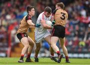 2 April 2017; Peter Kelleher of Cork in action against Ryan McAleenan, left, and Brendan McArdle of Down during the Allianz Football League Division 2 Round 7 match between Cork and Down at Páirc Uí Rinn in Cork. Photo by Eóin Noonan/Sportsfile