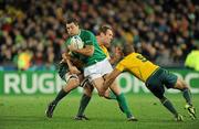 17 September 2011; Rob Kearney, Ireland, is tackled by Rocky Elsom, left, and Will Genia, Australia. 2011 Rugby World Cup, Pool C, Australia v Ireland, Eden Park, Auckland, New Zealand. Picture credit: Brendan Moran / SPORTSFILE