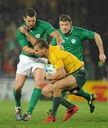 17 September 2011; Ireland's Rob Kearney and Brian O'Driscoll tackle Quade Cooper, Australia. 2011 Rugby World Cup, Pool C, Australia v Ireland, Eden Park, Auckland, New Zealand. Picture credit: Brendan Moran / SPORTSFILE