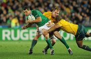 17 September 2011; Rob Kearney, Ireland, is tackled by Rocky Elsom, left, and Will Genia, Australia. 2011 Rugby World Cup, Pool C, Australia v Ireland, Eden Park, Auckland, New Zealand. Picture credit: Brendan Moran / SPORTSFILE