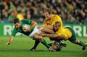 17 September 2011; Rob Kearney, Ireland, is tackled by Rocky Elsom, left, and Will Genia, Australia. 2011 Rugby World Cup, Pool C, Australia v Ireland, Eden Park, Auckland, New Zealand. Picture credit: Brendan Moran / SPORTSFILE