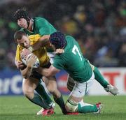 17 September 2011; Ireland's Stephen Ferris, left, and Sean O'Brien tackle Quade Cooper, Australia. 2011 Rugby World Cup, Pool C, Australia v Ireland, Eden Park, Auckland, New Zealand. Picture credit: David Rowland / SPORTSFILE