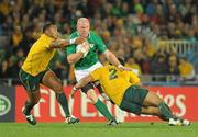 17 September 2011; Paul O'Connell, Ireland, is tackled by Sekope Kepu, left, and Stephen Moore, Australia. 2011 Rugby World Cup, Pool C, Australia v Ireland, Eden Park, Auckland, New Zealand. Picture credit: Brendan Moran / SPORTSFILE