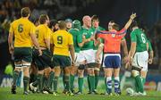 17 September 2011; Referee Bryce Lawrence gives a penalty to Ireland for Australia collapsing a scrum. 2011 Rugby World Cup, Pool C, Australia v Ireland, Eden Park, Auckland, New Zealand. Picture credit: Brendan Moran / SPORTSFILE
