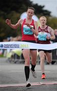 17 September 2011; Siobhan O'Doherty, Borrisokane, crosses the line to win the Women's event during the National Lottery Half Marathon. Phoenix Park, Dublin. Picture credit: Stephen McCarthy / SPORTSFILE
