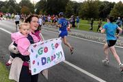 17 September 2011; Niamh Towey, age 14 months, from Gort, Co. Galway, and mother Aine cheer on Kieran Towey during the National Lottery Half Marathon. Phoenix Park, Dublin. Picture credit: Stephen McCarthy / SPORTSFILE