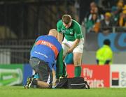 17 September 2011; Ireland's Gordon D'Arcy is attended to by team doctor Dr. Eanna Falvey. 2011 Rugby World Cup, Pool C, Australia v Ireland, Eden Park, Auckland, New Zealand. Picture credit: Brendan Moran / SPORTSFILE