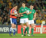17 September 2011; Referee Bryce Lawrence checks the ball pressure with Ireland out-half Jonathan Sexton. 2011 Rugby World Cup, Pool C, Australia v Ireland, Eden Park, Auckland, New Zealand. Picture credit: Brendan Moran / SPORTSFILE