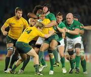 17 September 2011; Will Genia, Australia, is tackled by Ireland players Stephen Ferris, Paul O'Connell and Eoin Reddan. 2011 Rugby World Cup, Pool C, Australia v Ireland, Eden Park, Auckland, New Zealand. Picture credit: Brendan Moran / SPORTSFILE