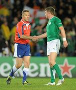 17 September 2011; Ireland out-half Ronan O'Gara shakes hands with referee Bryce Lawrence at the end of the game. 2011 Rugby World Cup, Pool C, Australia v Ireland, Eden Park, Auckland, New Zealand. Picture credit: Brendan Moran / SPORTSFILE