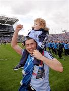 18 September 2011; Alan Brogan, Dublin, with his son Jamie, aged 2, celebrates victory after the game. GAA Football All-Ireland Senior Championship Final, Kerry v Dublin, Croke Park, Dublin. Picture credit: Stephen McCarthy / SPORTSFILE