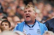 18 September 2011; A Dublin supporter encourages his team during the final minutes of the game. Supporters at the GAA Football All-Ireland Championship Finals, Croke Park, Dublin. Picture credit: Pat Murphy / SPORTSFILE