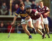 14 April 2002; Liam Hodgins of Galway in action against John Carroll of Tipperary during the Allianz National Hurling League Quarter-Final match between Galway and Tipperary at Semple Stadium in Thurles, Tipperary. Photo by Brendan Moran/Sportsfile