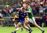 14 April 2002; Clare goalkeeper David Fitzgerald in action against Conor Fitzgerald of Limerick during the Allianz National Hurling League Quarter-Final match between Clare and Limerick at Semple Stadium in Thurles. Photo by Pat Murphy/Sportsfile