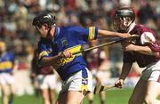14 April 2002; Eddie Enright of Tipperary in action against Francis Forde of Galway during the Allianz National Hurling League Quarter-Final match between Galway and Tipperary at Semple Stadium in Thurles, Tipperary. Photo by Brian Lawless/Sportsfile