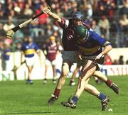 14 April 2002; David Kennedy of Tipperary in action against Damien Hayes of Galway during the Allianz National Hurling League Quarter-Final match between Galway and Tipperary at Semple Stadium in Thurles, Tipperary. Photo by Brian Lawless/Sportsfile