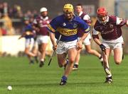 14 April 2002; Liam Cahill of Tipperary in action against Ollie Canning of Galway during the Allianz National Hurling League Quarter-Final match between Galway and Tipperary at Semple Stadium in Thurles, Tipperary. Photo by Brian Lawless/Sportsfile
