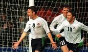 17 April 2002;  Mark Kinsella of Republic of Ireland, 8, celebrates his goal with team-mates Robbie Keane, 10 and Kevin Kilbane after scoring his side's first goal during the International Friendly match between Republic of Ireland and USA at Lansdowne Road in Dublin. Photo by Brendan Moran/Sportsfile