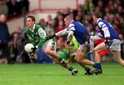 21 April 2002; Declan Sullivan of Coláiste na Sceilge in action against Darren Mullahy and Gary Sice, right, of St Jarlath's College during the Post Primary Schools Hogan Cup Senior A Football Championship Semi-Final Replay match between St Jarlath's College and Coláiste na Sceilge at the Gaelic Grounds in Limerick. Photo by Damien Eagers/Sportsfile