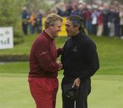 21 April 2002; Colin Montgomerie of Great Britain and Ireland Captain congratulates Seve Ballesteros, Continental Europe Captain,  after Seve Ballesteros pared the last hole to win his game by one hole during day three of the Seve Trophy tournament between Great Britain and Ireland vs Continental Europe at Druids Glen in Wicklow. Photo by Matt Browne/Sportsfile