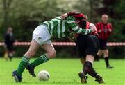 21 April 2002: Patrick Rooney of St Francis in action against Danny Gillie of Rush Athletic during the Leinster Senior League Vere Deane Cup Semi-Final match  between St Francis and Rush Athletic at Stanaway Park in Crumlin, Dublin. Photo by Ray Lohan/Sportsfile