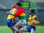 14 April 2002; Johnny Nevin of Carlow in action against Michael Keaveney, left, and Tomas Lennon of Roscommon during the Allianz National Hurling League Division 2 Relegation Play-Off match between Carlow and Roscommon at Cusack Park in Mullingar, Westmeath. Photo by Aoife Rice/Sportsfile