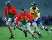 14 April 2002; Gary Doyle of Carlow in action against Mickey Cunniffe of Roscommon during the Allianz National Hurling League Division 2 Relegation Play-Off match between Carlow and Roscommon at Cusack Park in Mullingar, Westmeath. Photo by Aoife Rice/Sportsfile