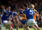 14 April 2002; Francie Grehan of Roscommon is tackled by Thomas Prior, left and Michael Brides of Cavan during the Allianz National Football League Semi-Final match between Cavan and Roscommon at Cusack Park in Mullingar, Westmeath. Photo by Aoife Rice/Sportsfile