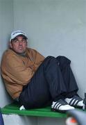 24 April 2002; Paul McGinley shelters from the rain during the Pro Am round ahead of the Smurfit Irish PGA Championship at Westport Golf Club in Mayo. Photo by Damien Eagers/Sportsfile