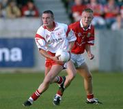 9 September 2001; Ciaran Meenagh of Tyrone in action against Conrad Murphy of Cork during the All-Ireland Under 21 Football Championship Semi-Final match between Tyrone and Cork at Parnell Park in Dublin. Photo by David Maher/Sportsfile