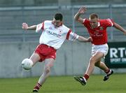 9 September 2001; Enda McGinley of Tyrone in action against Conrad Murphy of Cork during the All-Ireland Under 21 Football Championship Semi-Final match between Tyrone and Cork at Parnell Park in Dublin. Photo by David Maher/Sportsfile