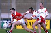 9 September 2001; Sean O'Brian of Cork in action against Ciaran Meenagh of Tyrone during the All-Ireland Under 21 Football Championship Semi-Final match between Tyrone and Cork at Parnell Park in Dublin. Photo by David Maher/Sportsfile