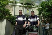 25 April 2002; Munster captain Mick Galwey and team-mate Alan Quinlan arrive in Montpellier Airport in France. Photo by Matt Browne/Sportsfile